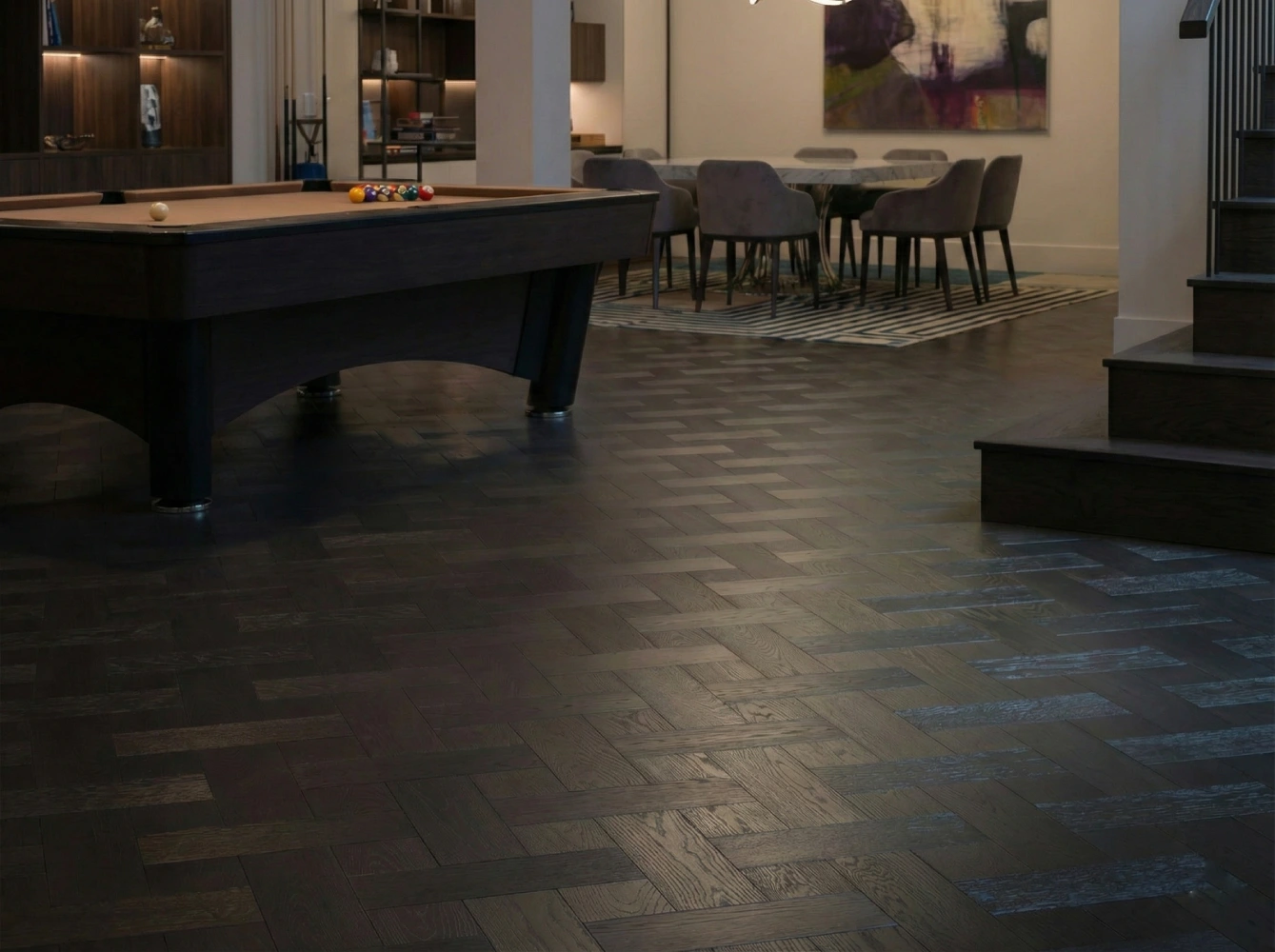 Luxury home entertainment room with a pool table, featuring dark smoked oak plank flooring with square inserts for a sophisticated atmosphere.