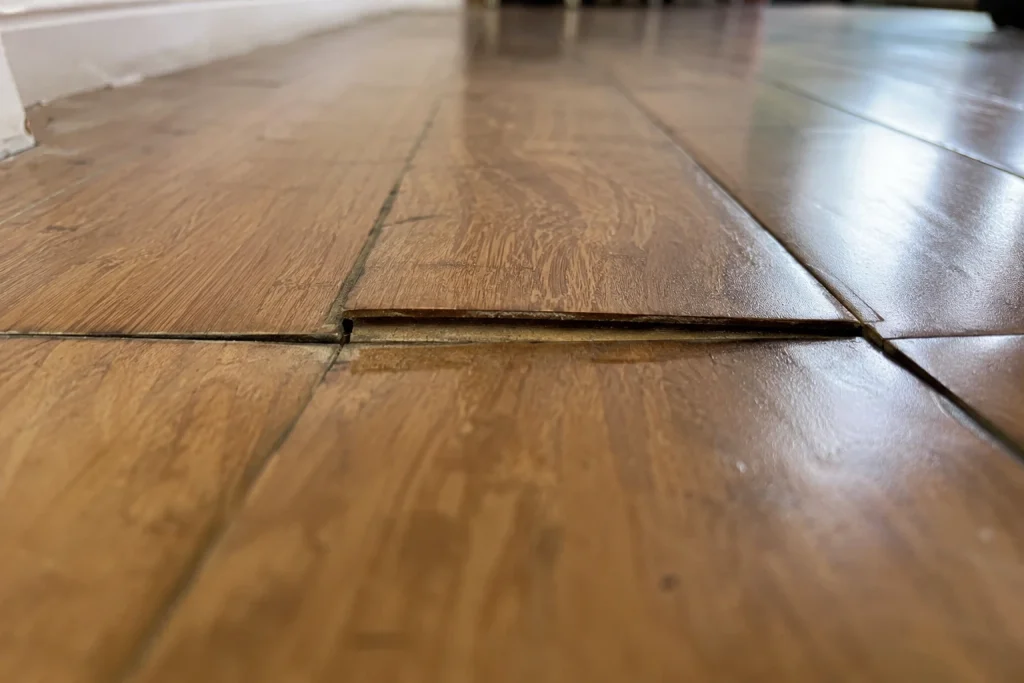 Cupped and water-damaged engineered hardwood boards that are poor candidates for refinishing